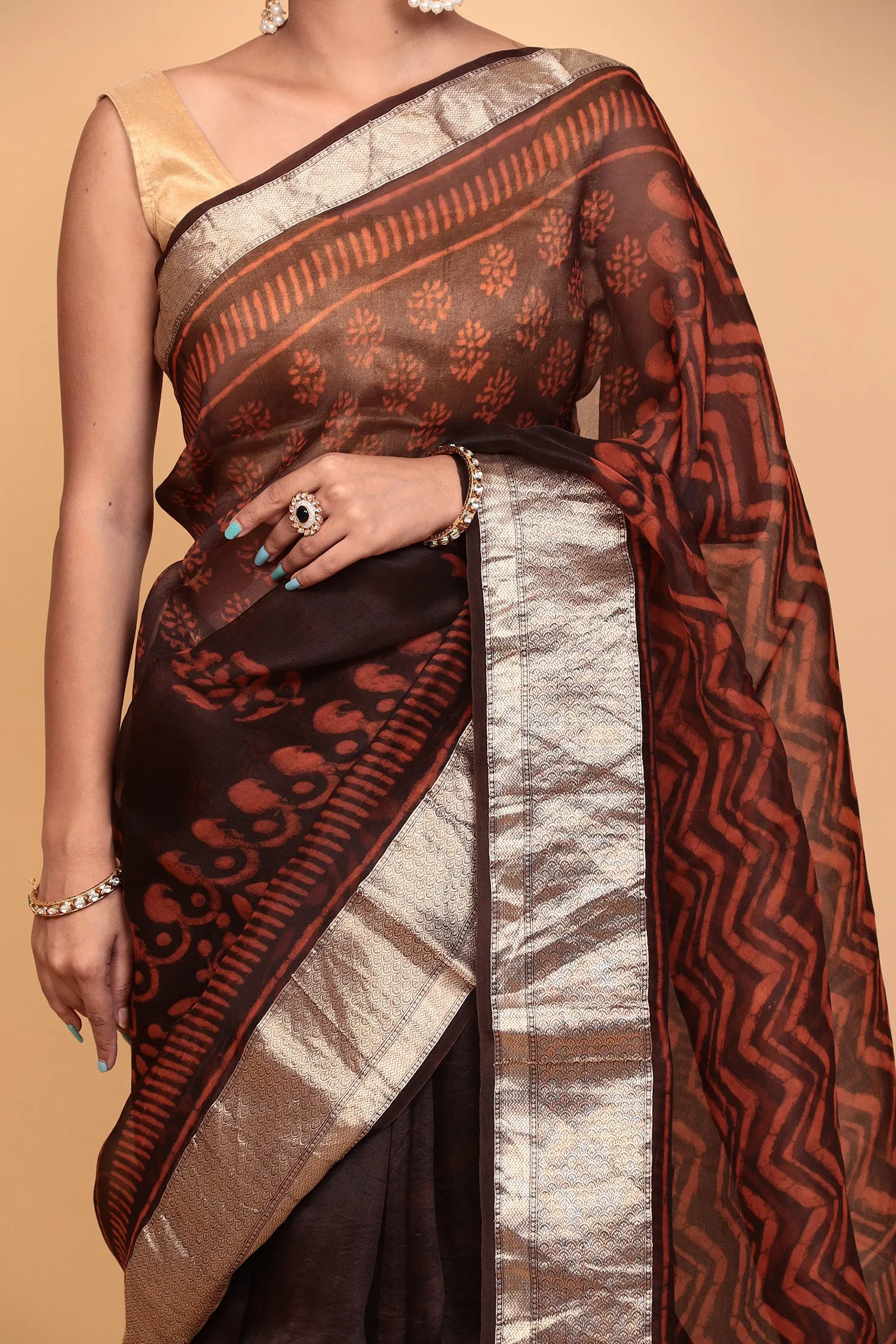 Dabu print Organza Saree with Zari work.