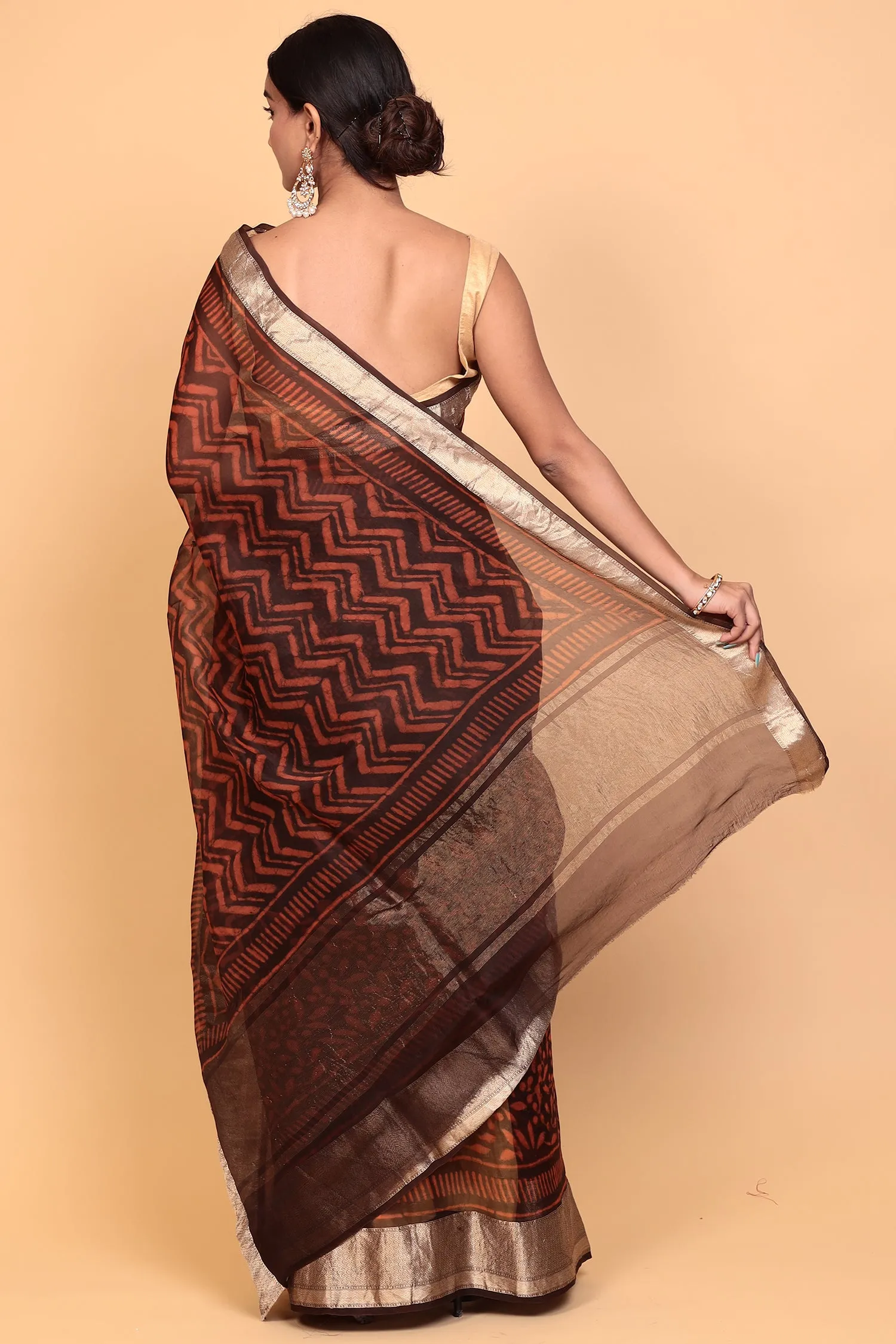 Dabu print Organza Saree with Zari work.