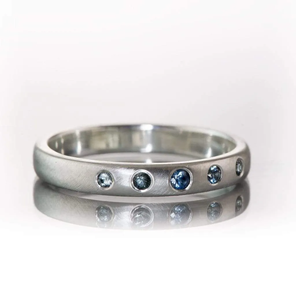 Domed Wedding Band with Graduated Flush set Montana Sapphire