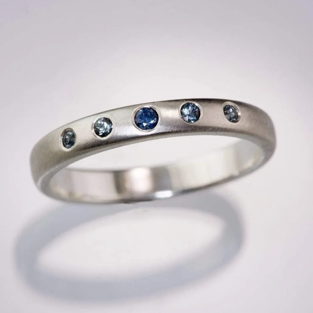 Domed Wedding Band with Graduated Flush set Montana Sapphire