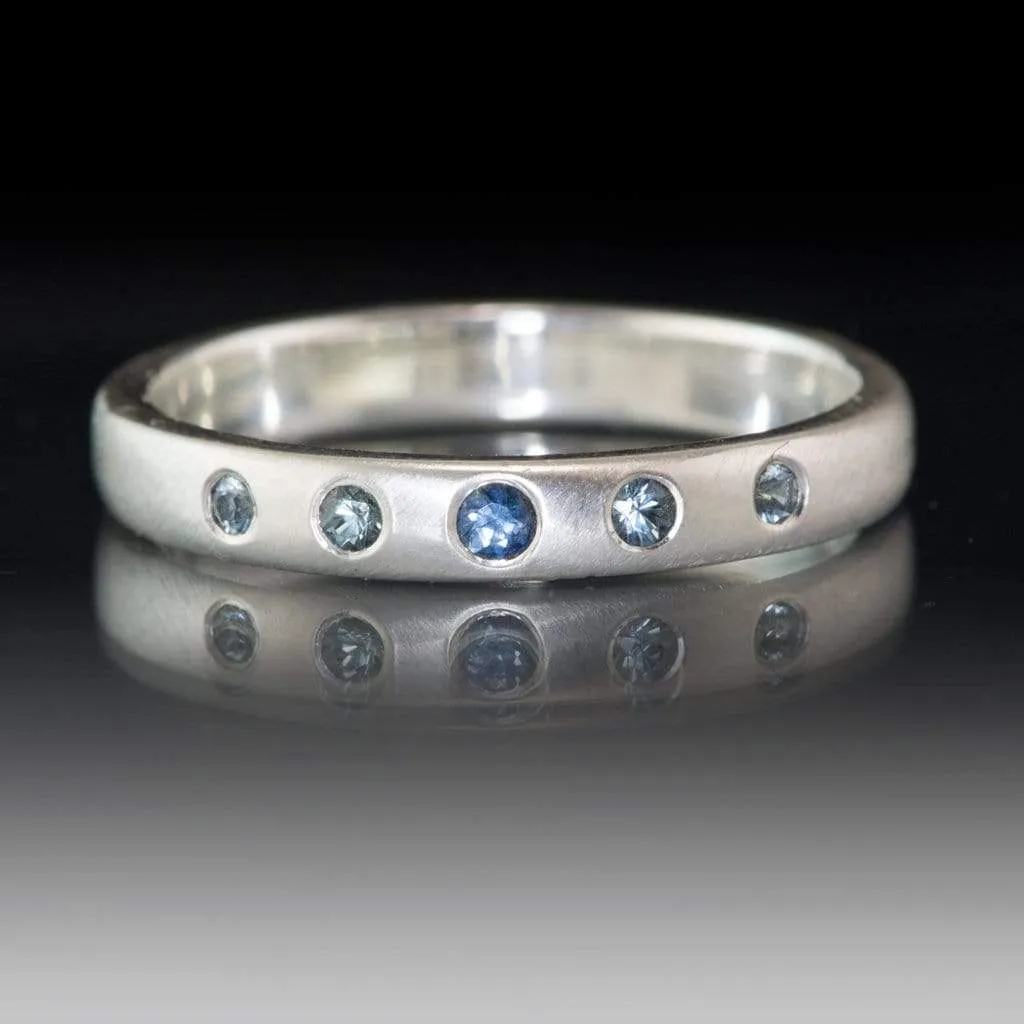 Domed Wedding Band with Graduated Flush set Montana Sapphire