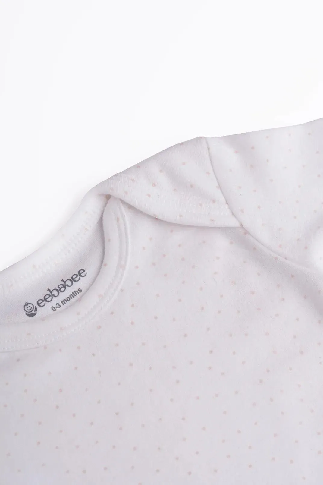 Full sleeve soft pink dot pattern in white bodysuit for baby