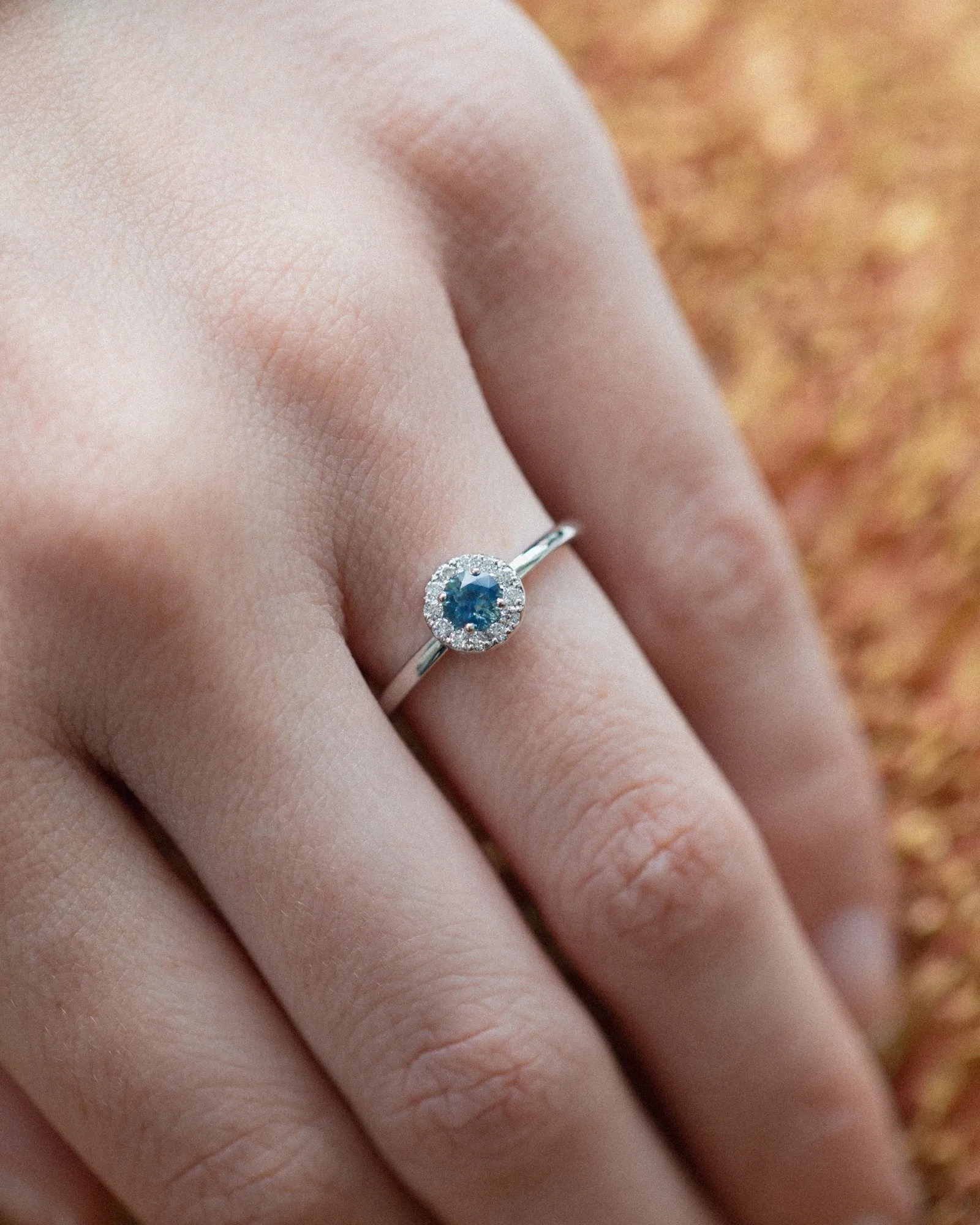 Round Halo Ring In 14k Fairmined Gold with Montana Sapphire and lab grown Diamonds